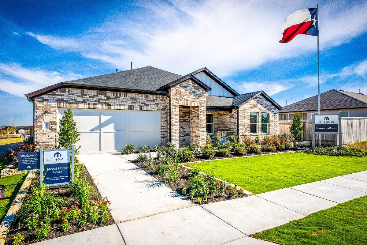 This is the front exterior of the Hawkins plan. This is the model home located in Carillon at 133...