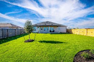This is the back exterior of the Hawkins plan and is the model home in Carillon at 13305 Eppright...