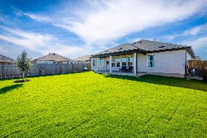 This is the back exterior of the Hawkins plan and is the model home in Carillon at 13305 Eppright...