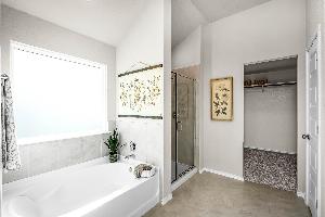 This is the primary bathroom of the Hawkins plan and is the model home in Carillon at 13305 Eppri...
