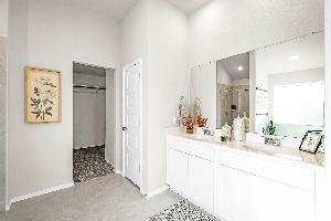 This is the primary bathroom of the Hawkins plan and is the model home in Carillon at 13305 Eppri...