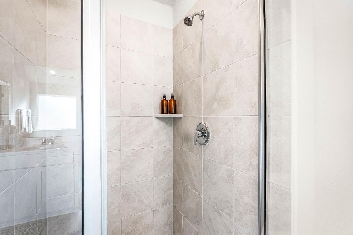 These are images of the secondary bathrooms in the Hawkins plan and is the model home in Carillon...
