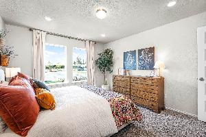 These are the secondary bedrooms of the Hawkins plan and is the model home in Carillon at 13305 E...
