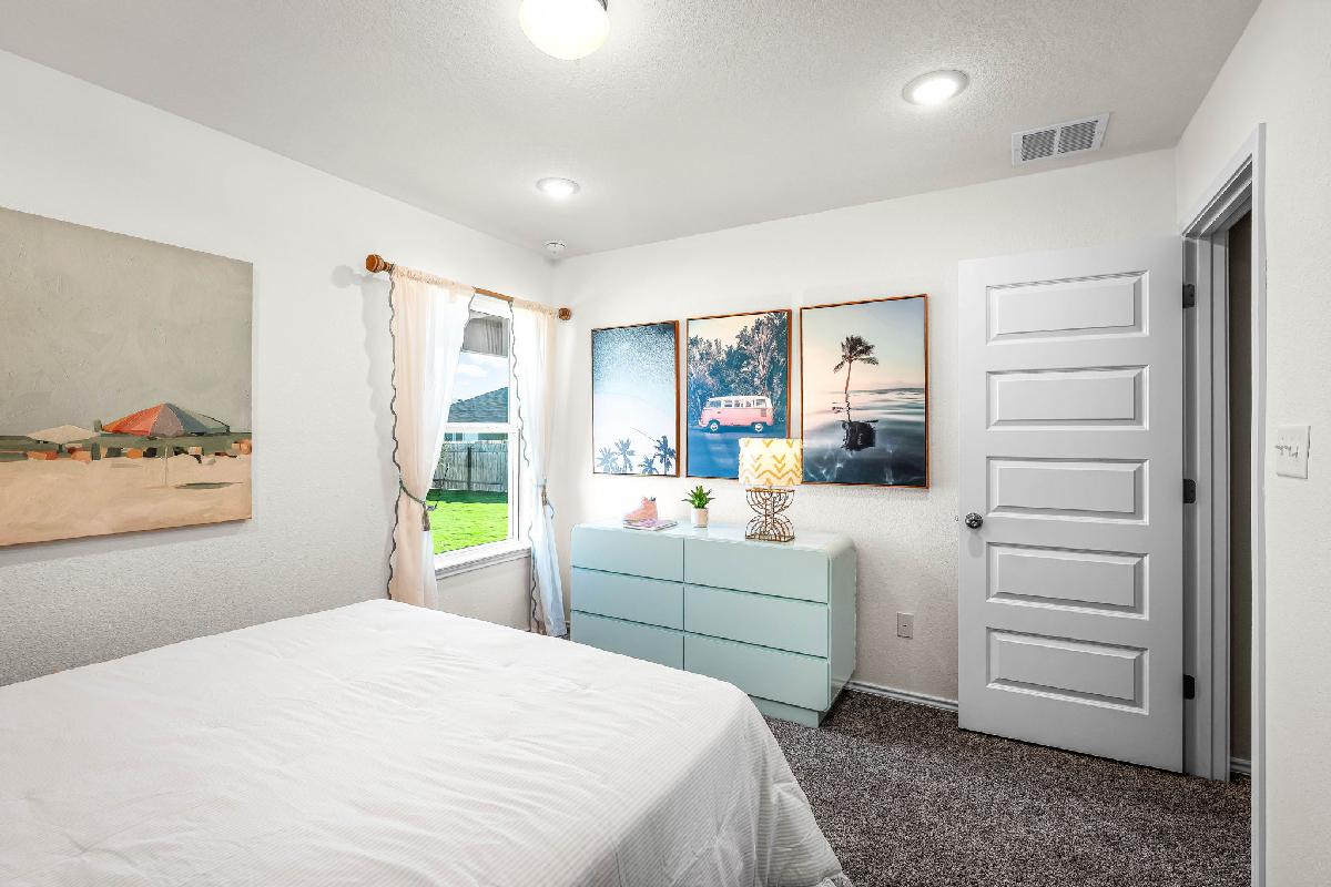 These are the secondary bedrooms of the Hawkins plan and is the model home in Carillon at 13305 E...