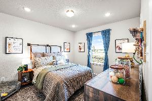 These are the secondary bedrooms of the Hawkins plan and is the model home in Carillon at 13305 E...