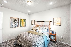 These are the secondary bedrooms of the Hawkins plan and is the model home in Carillon at 13305 E...