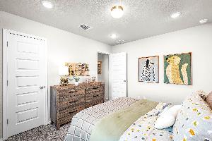 These are the secondary bedrooms of the Hawkins plan and is the model home in Carillon at 13305 E...