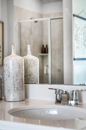 These are images of the secondary bathrooms in the Hawkins plan and is the model home in Carillon...